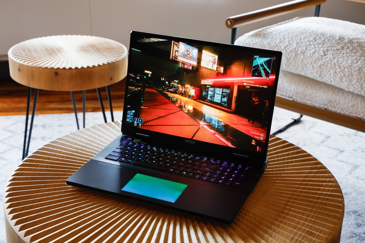 MSI Titan 18 HX, gaming laptop, review, RTX 5090, Intel Core Ultra 9 285HX, 4K mini-LED display, desktop replacement, price, performance, benchmarks, battery life, thermal performance, mechanical keyboard, Cherry switches, DLSS 4, frame generation, Razer Blade 16, Trump tariffs, import taxes, high-end laptop, gaming PC, ultra settings, Cyberpunk 2077, Horizon Zero Dawn Remastered, Black Myth Wukong, laptop GPU, gaming CPU, DDR5 RAM, storage, mobile PC, excessive gaming laptop, luxury laptop
