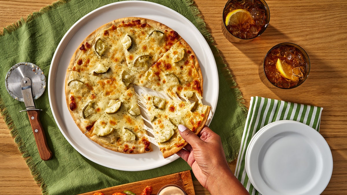dill pickle pizza, California Pizza Kitchen, Target, frozen pizza, pickle pizza, controversial topping, food trends, pizza toppings, new product, food review, Caulipower, Good & Gather, Domino's, Pizza Hut, Wisconsin State Fair, pickle craze
