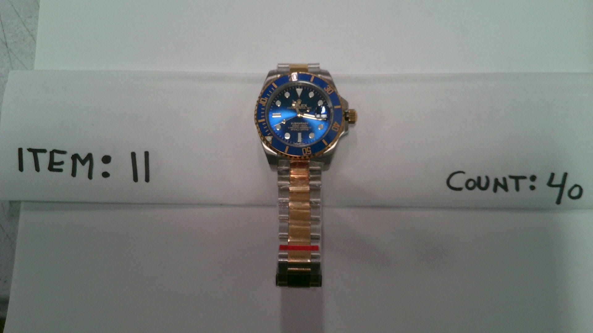 sahte saatler, ABD Gümrük ve Sınır Koruma, CBP, O'Hare Havaalanı, Chicago, Rolex Submariner, Audemars Piguet Royal Oak, Omega Speedmaster, Çin, Bensonville, Illinois, LaFonda D. Sutton-Burke, kaçakçılık, fikri mülkiyet hakları, counterfeit goods, taklit ürünler, saat kaçakçılığı, ABD ekonomisi, vergi kaybı
