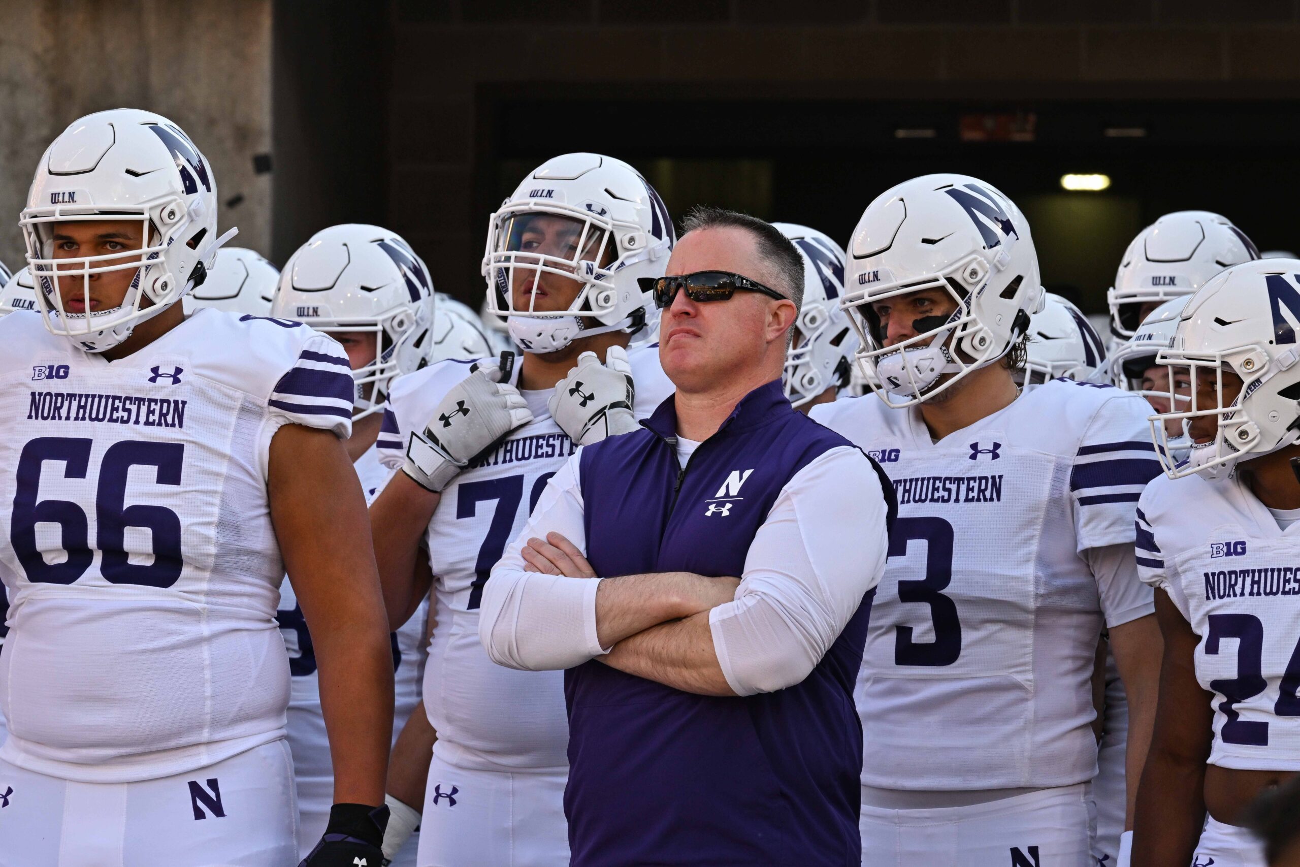 Here are some meta keywords in Turkish for the article, focusing on the core topics and potential search terms:

Northwestern Üniversitesi, taciz davası, futbolcular, Pat Fitzgerald, tazminat, uzlaşma, dava, Wildcats, cinsel taciz, sporcu davaları, öğrenci davaları, Northwestern futbol takımı, hazing, Chicago, Cook County mahkemesi, yasal anlaşma, spor skandalı, Lloyd Yates, Illinois
